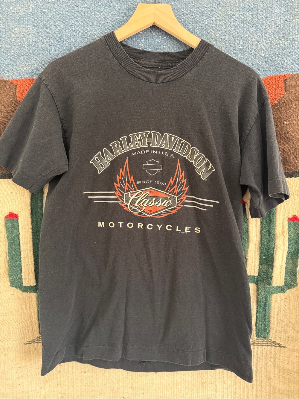 Harley-Davidson of Madrid Black Tee with Orange & White Wings Graphic